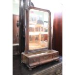 A George III mahogany toilet mirror on three drawer base with ogee feet