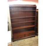 A 19th Century mahogany waterfall bookcase with two drawers on bracket feet