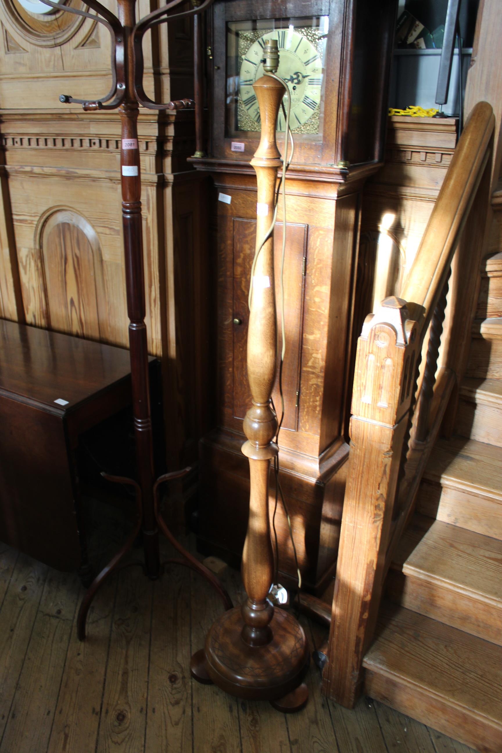 A 1960's stained oak standard lamp