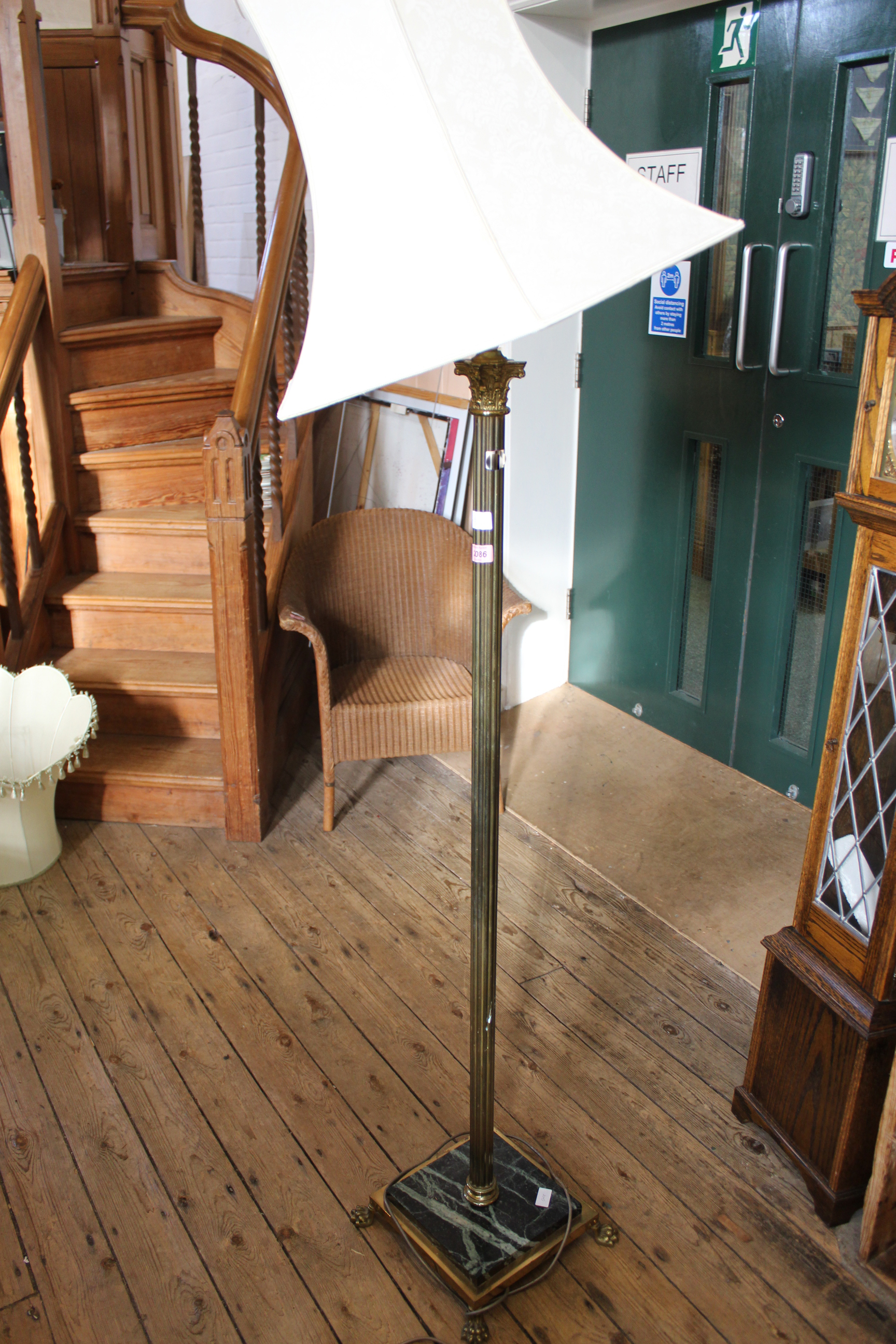 A brass and marble base standard lamp