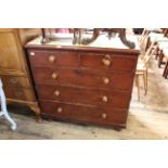 A Victorian stained pine five drawer chest