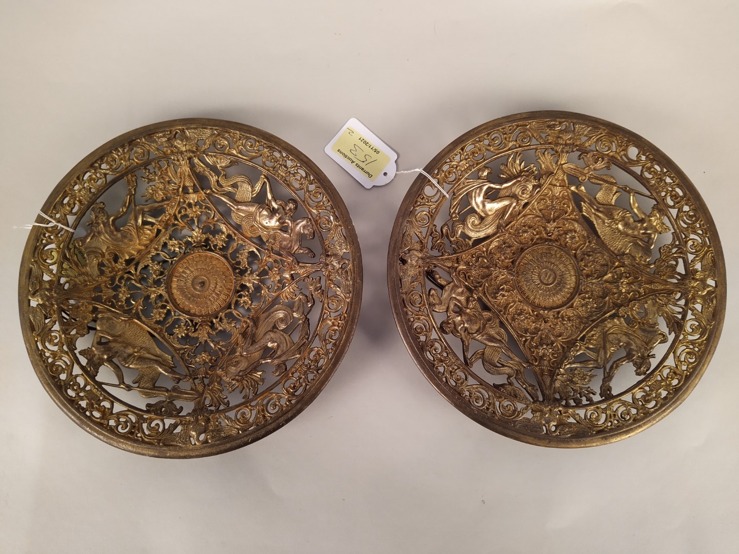 A pair of Coalbrookdale style gilded metal plaques,
