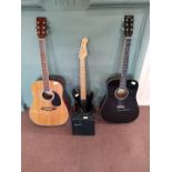 An Encore acoustic guitar, a Freedom acoustic guitar,