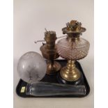 A 'Youngs Special' brass base oil lamp with shade and funnel plus an Aladdin brass oil lamp with