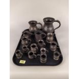 A selection of fifteen 19th Century pewter tankards and measures