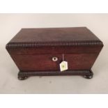 An early 19th Century rosewood sarcophagus double tea caddy with two separate lift out tea