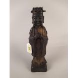 A Chinese hollow cast, formally gilded bronze figure,