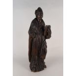 An 18th Century carved oak ecclesiastical figure, 66cm tall (lacking one hand,