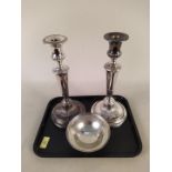 A pair of Georgian style silver plated candlesticks plus a Walker & Hall silver dish with pierced