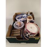 A box of mixed items including cutlery, a drum shaped ice bucket, blue and white china,