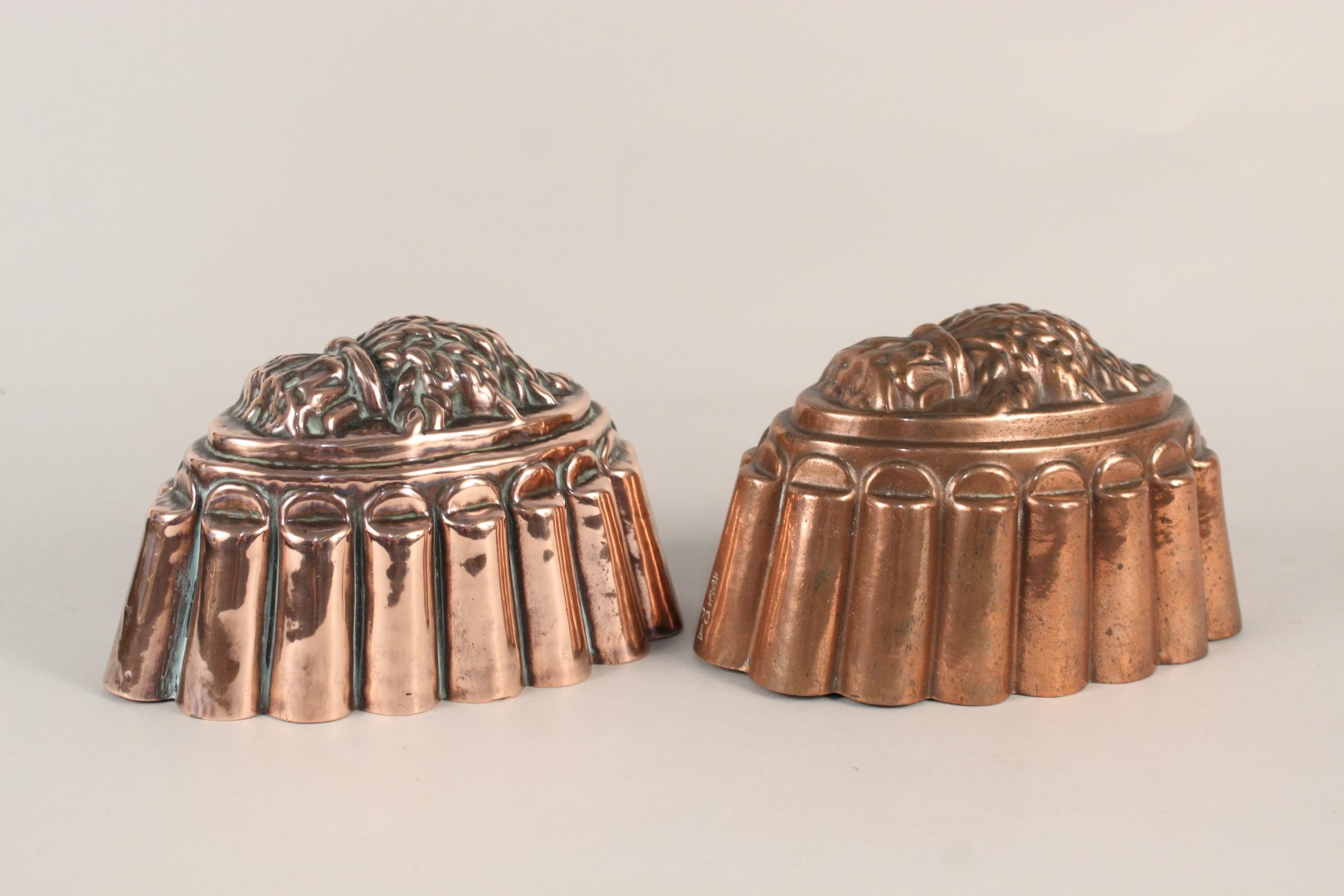 A pair of Victorian copper jelly moulds of fluted oval form,