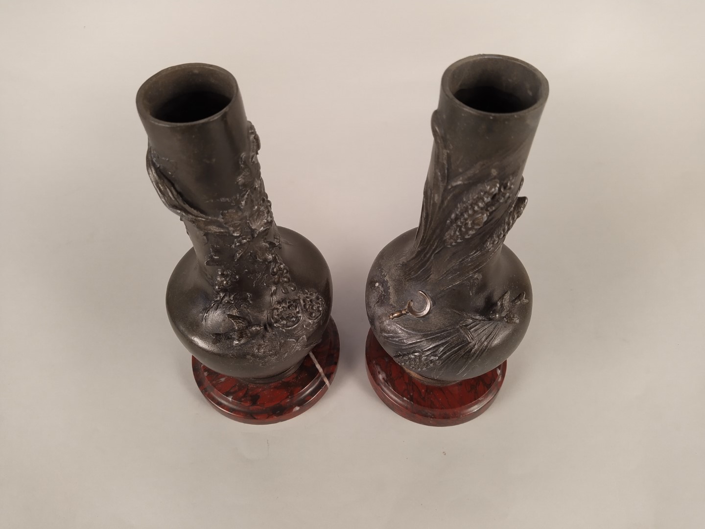 A pair of late 19th Century spelter vases on marble bases with raised decoration emblematic of - Image 2 of 3