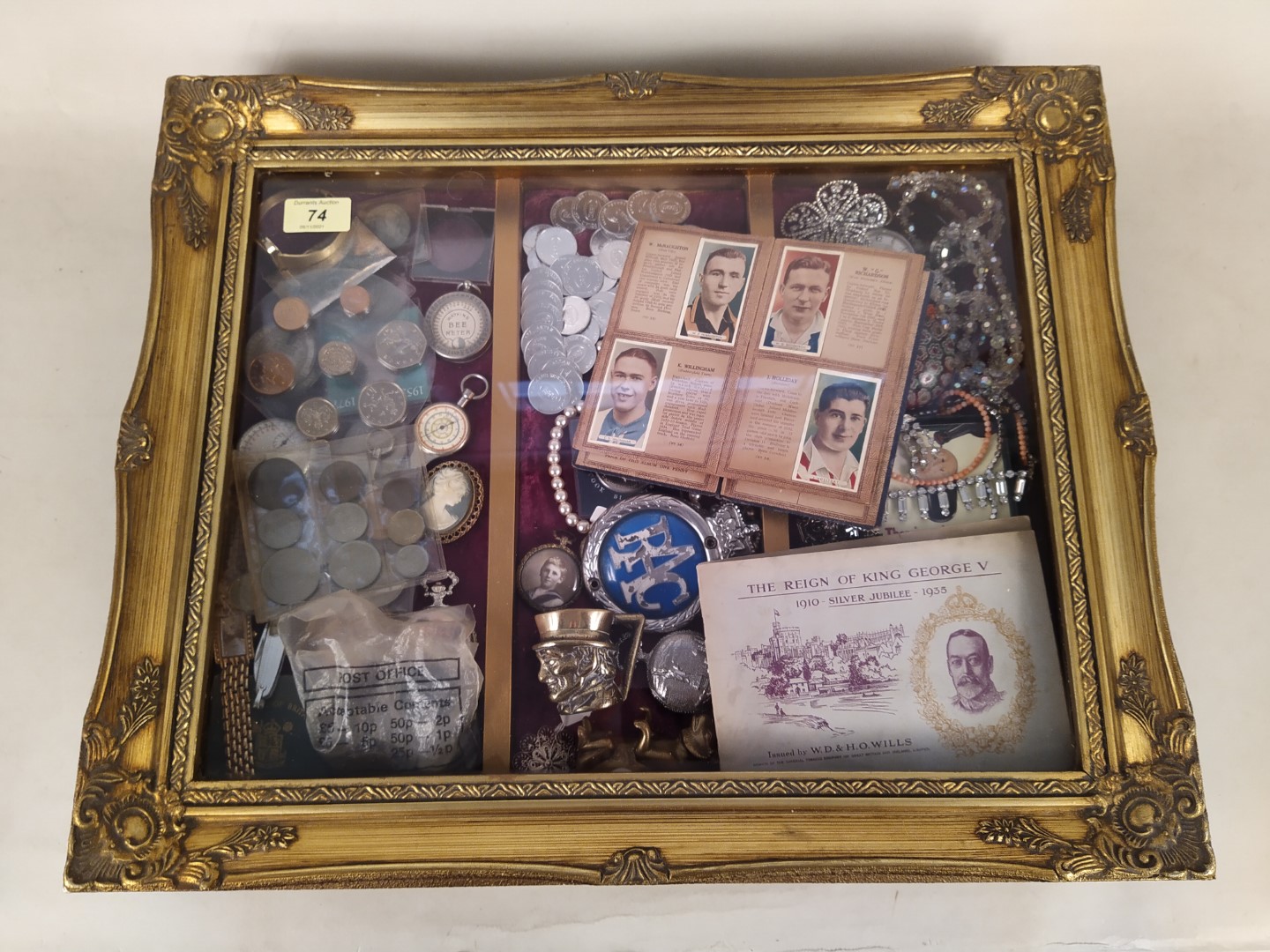 A table top display cabinet and contents including coins, costume jewellery, watches etc,