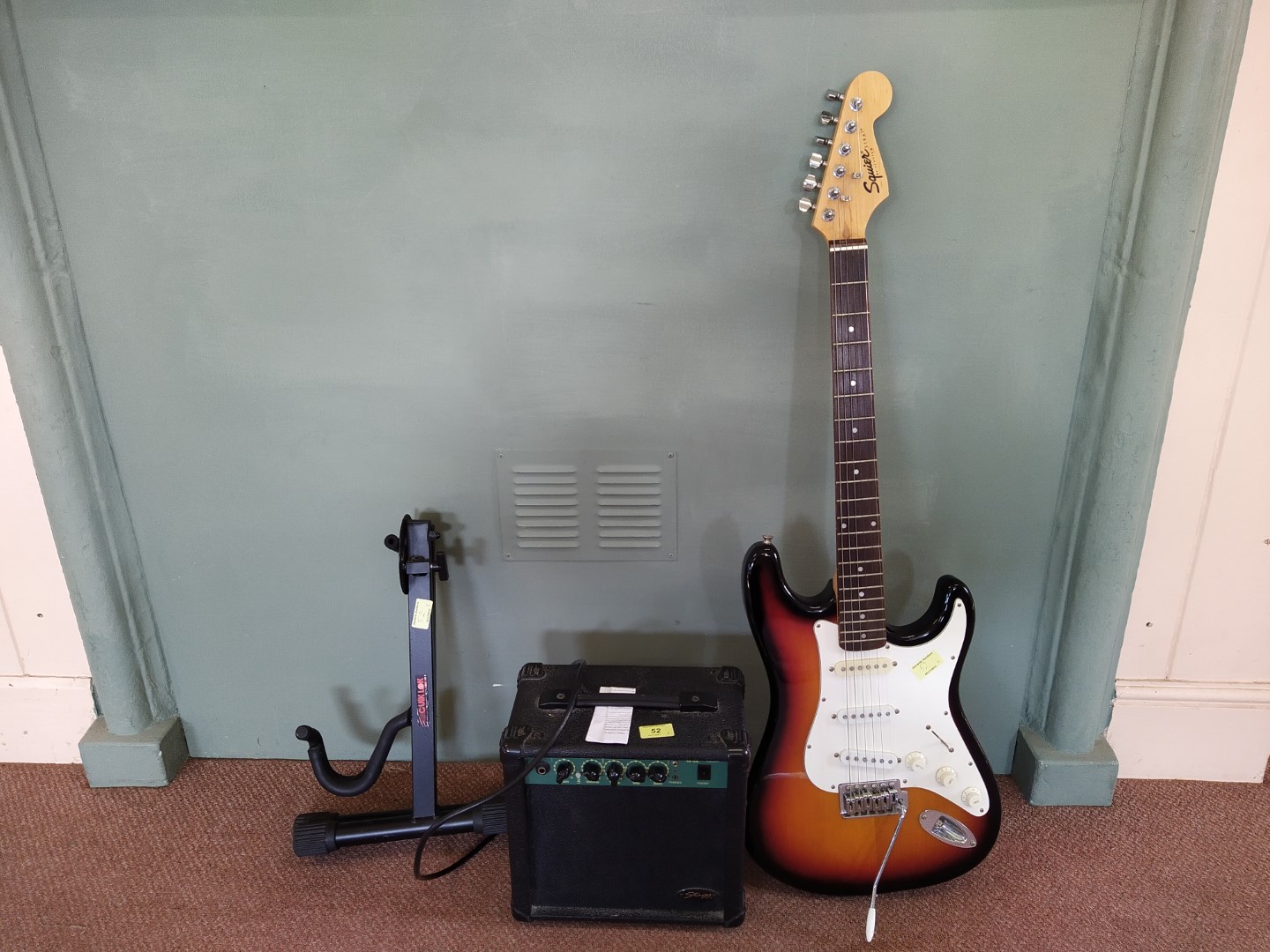 Fender Squire 'Strat' electric guitar with stand and amp