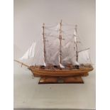 A large handmade (from kit) wooden model of The Cutty Sark mounted on wooden base, fully rigged,