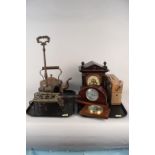 A large vintage wooden cased mantel clock, a small Swiss made one, a vintage Phillips radio,