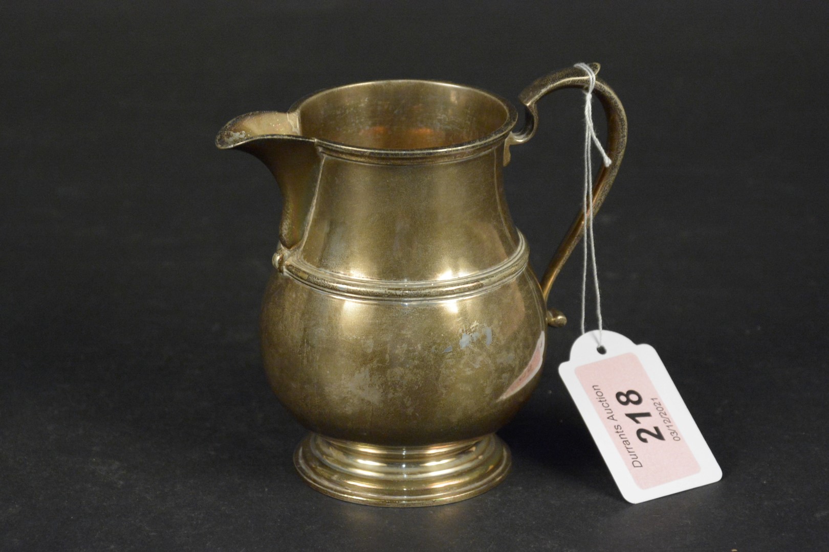 A silver milk jug, hallmarked Birmingham 1922, makers mark Adie Brothers Ltd,