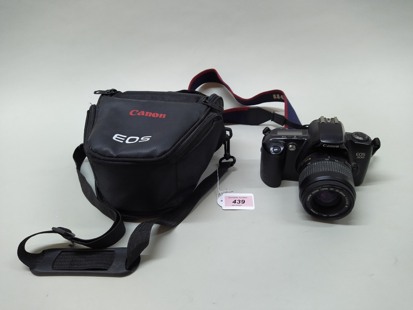 A Canon EOS 500 camera body with a 35-80mm lens plus a Canon case