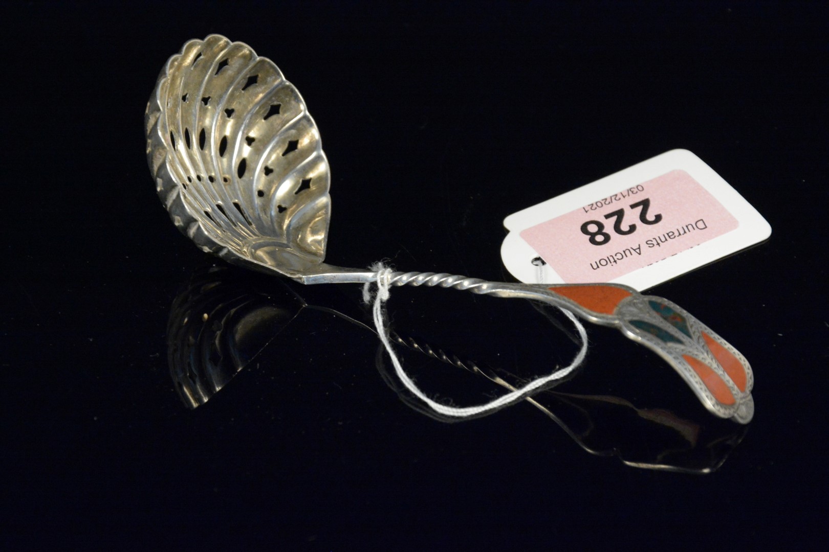 A Victorian silver sifting spoon with hard stones inset to handle, hallmarked Birmingham 1896,