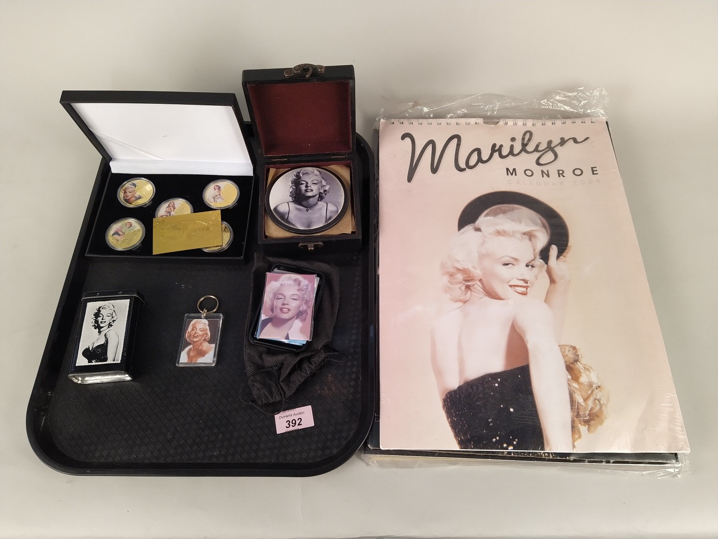 A selection of mixed Marilyn Monroe collectables including cased gilded coins, fridge magnets,