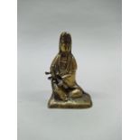 A Chinese brass Buddha with baby