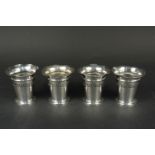 A set of four silver vases (one of four with weighted bases, rest have been removed),
