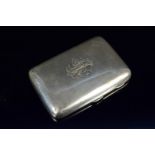 A silver cigar case of plain design, engraved with monogram and Peale 1919 to front,