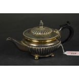 A bachelors silver teapot with fluted decoration and wooden handle, hallmarked Sheffield 1896,