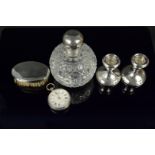 A mixed lot consisting of a cut glass silver lidded perfume bottle,