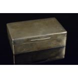 A silver wood lined cigarette box of plain design, engraved monogram to lid, hallmarked London 1909,