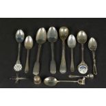 A collection of silver spoons including an enamelled example, a thimble and cross pendant,