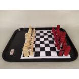 A vintage Anglo Indian ivory and stained ivory chess set (some pieces as found)