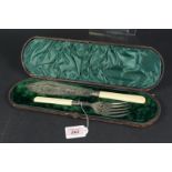 A cased pair of Victorian silver and ivory fish servers with pierced and engraved decoration,