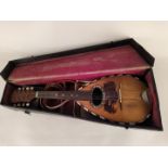 A late 19th Century cased mandolin, bears label Francesco Perretti,