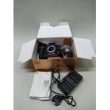 A Nikon D3 camera body with a Nikon 70-300mm lens and charger (as found) in original box