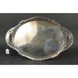 A large oval silver plated two handled tray with pierced decoration