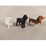 Three Beswick dog figurines