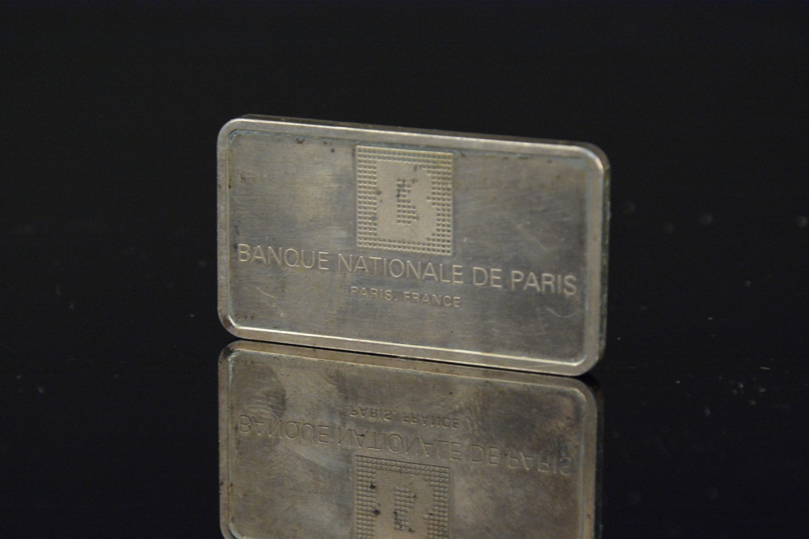 A National Paris Bank silver ingot,