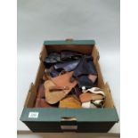 A box of various leather holsters (some with magazines) etc