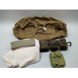 A 1944 dated holdall with contents including thermal underwear and puttees