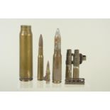 A mixed lot including two WWII dated linked .50 cal cases, an inert .