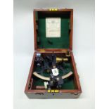 A cased sextant with accessories by 'H Hughes & Son Ltd London', trade label to inside of lid,