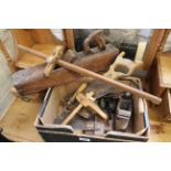 A box of assorted workshop and woodworking hand tools