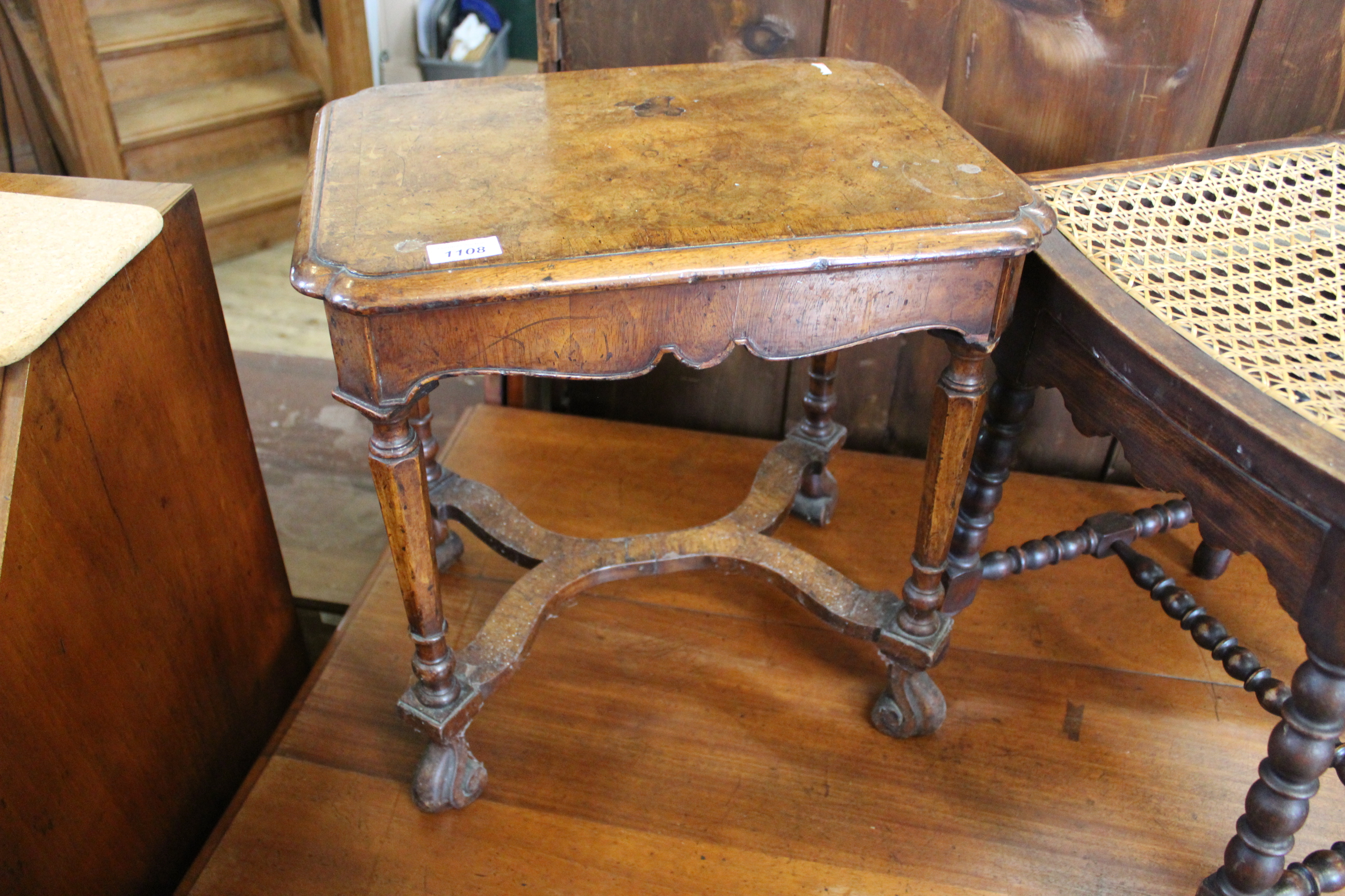 A Victorian walnut x-framed low table