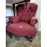 A Victorian style upholstered armchair