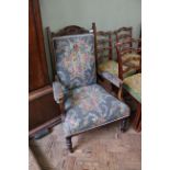 An Edwardian upholstered armchair