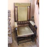 An Edwardian stained beech rocking chair