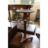 A mid Victorian mahogany wine table with later added top