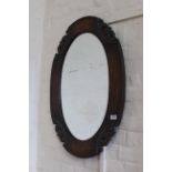 A 1950's oak wall mirror
