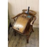A beech and elm Captain's chair with draught shaped back splat plus an Edwardian oak coal scuttle